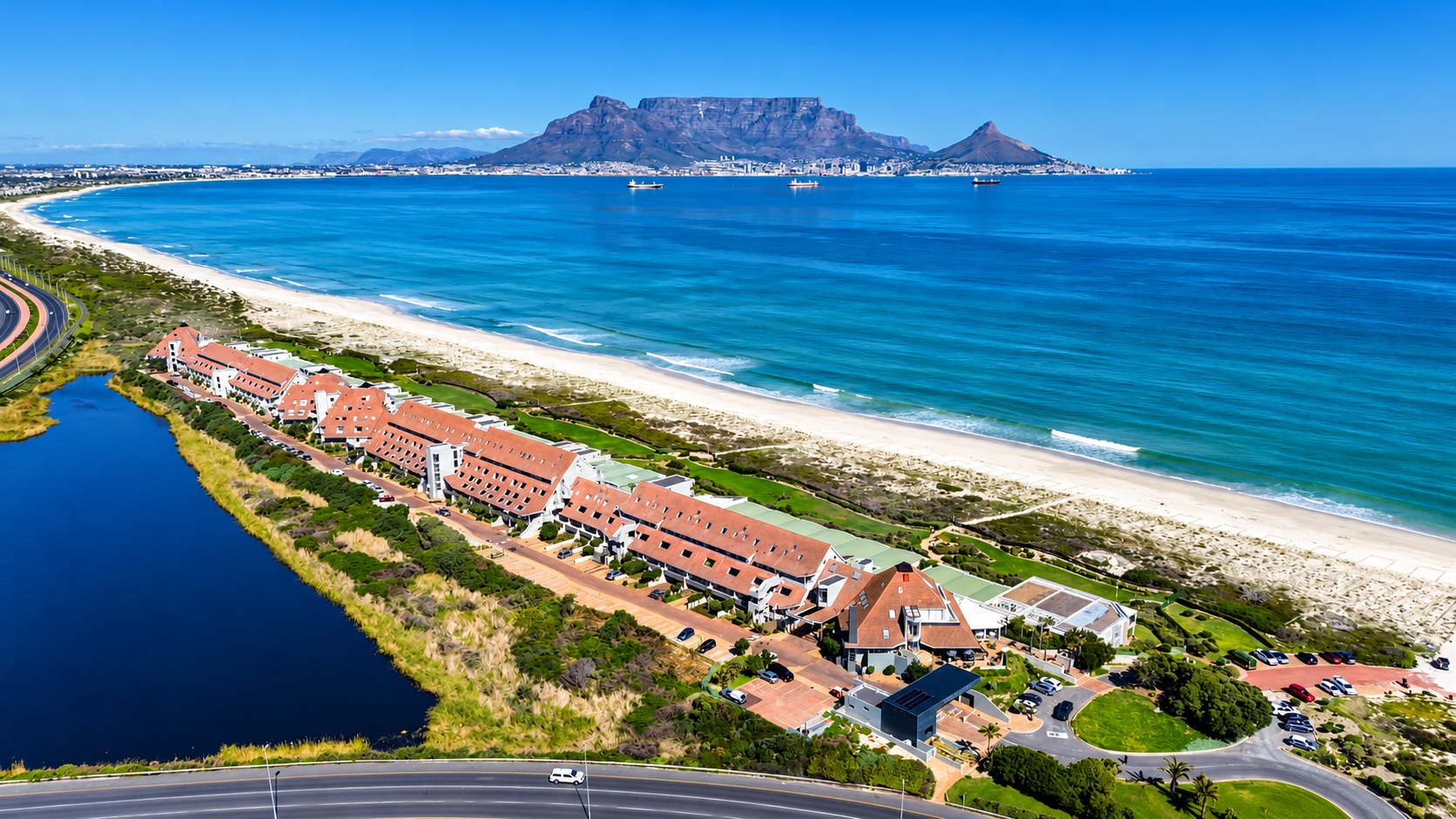 Aerial view of Dolphin Beach Estate on the Blouberg beachfront with Table Mountain across the bay
