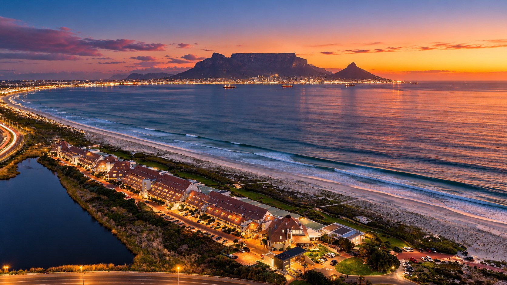 Twilight over the Blouberg beachfront with Table Mountain and the city lights across the bay